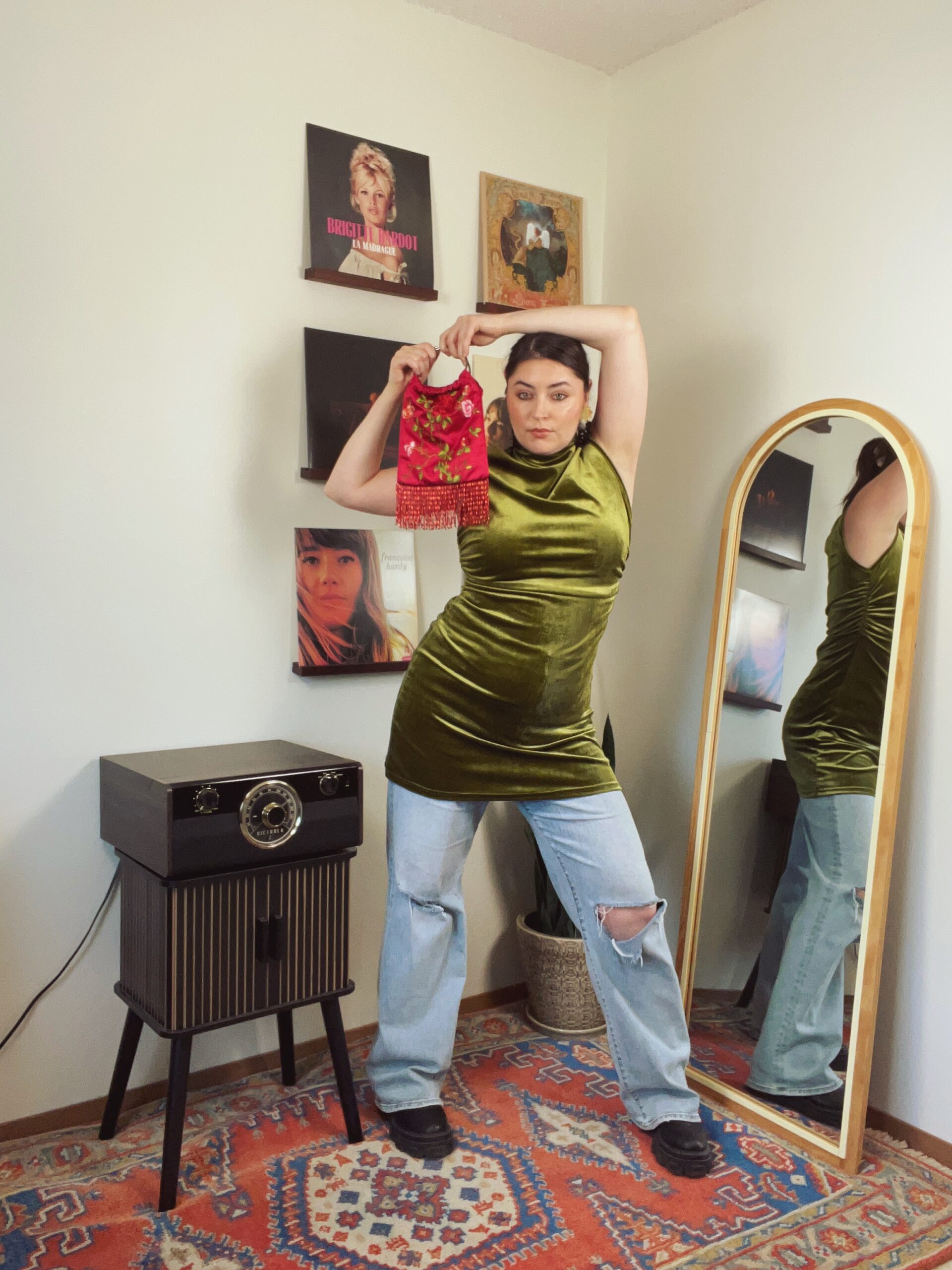 Free Yourself from Convention by Styling a Velvet Mini Dress Over Ripped Jeans